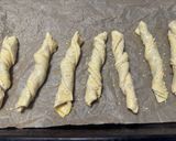 A picture of step 7 of Puff Pastry Twists with 'Nduja Spread, Speck, and Ragusano Cheese.