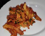 A picture of step 5 of Masala fries/ chips.