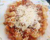 A picture of step 8 of Cheesy Macaroni in tomato and cream sauce.