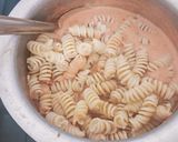 A picture of step 4 of Pink sauce Pasta with Cheesy Garlic Bread.