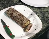 A picture of step 8 of Dates mawa Swiss roll burfi.