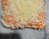 A picture of step 4 of Carrot toast with cheese spread.