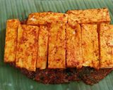 A picture of step 10 of Paneer wrapped in banana leaf.