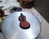 A picture of step 2 of Birthday cake music theme top on fondant guitar 🎸🎸🎸.