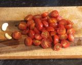 A picture of step 1 of Sea Bass with cherry tomatoes al cartoccio.