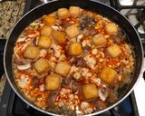 A picture of step 4 of Bún Riêu Ốc (Vietnamese Snail and Crab Noodle Soup).