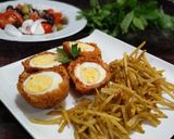 Foto del paso 4 de la receta: Huevos a la escocesa con chorizo y patatas paja