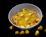 A picture of step 5 of Spaghetti in mango sauce topped with mango cubes.