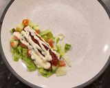 A picture of step 3 of Chipotle Chicken with Chilli Jam salad bed.