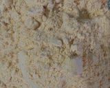 A picture of step 1 of Besan laddoo with sunflower and flax seeds.