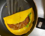 A picture of step 3 of Omu Sandwich (Sandwich wrapped with egg fry).