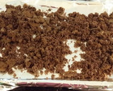 A picture of step 11 of Chocolate Layer Cake with Strawberry Cream Filling, White Chocolate Ganache Frosting coated with a Chocolate Crumble.