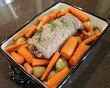 A picture of step 4 of Hearb roasted leg of lamb roll with potatoes and carrots.
