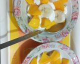 A picture of step 3 of ICE CREAM 🍦with mango toppings.