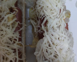 Foto del paso 5 de la receta: Perritos calientes con cebolla y queso