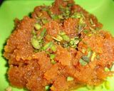 A picture of step 6 of Moong Dal Halwa Cigars dipped in Shaahi Rabdi.