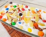 A picture of step 4 of Pineapple delight with m&m bunties.
