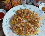 A picture of step 10 of Cheesy Mexican Veg Pizza.