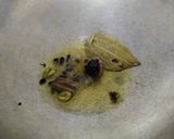 A picture of step 1 of Jeera Rice with Whole Spices.