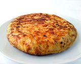 A picture of step 7 of Spanish Omelette with Goat Cheese and Caramelized Onion.