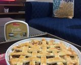 A picture of step 12 of Apple pie with flaky butter crust served with vanilla ice cream.