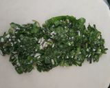 A picture of step 4 of Jingalov hats Armenian herb stuffed flatbread .