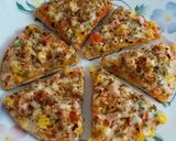 A picture of step 10 of Cheesy Mexican Veg Pizza.