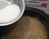 A picture of step 6 of Manchow Soup / Veg soup topped with Crispy fried noodles.