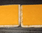 A picture of step 2 of Cheddar and brown sauce toastie.