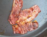 A picture of step 2 of French toast with bacon and caramelized bananas.