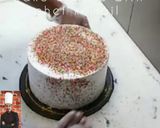 A picture of step 4 of Bow on top full cover sprinkles cake 🎀.