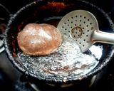 A picture of step 4 of Manipuri Chak hao tal / black rice poori.