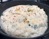 A picture of step 4 of Cheddar, Broccoli and Red Chilli Soufflé Omelette, Garlic roasted Cherry Plum Tomatoes, Olive Oil.