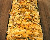 A picture of step 4 of Pull apart garlic bread.