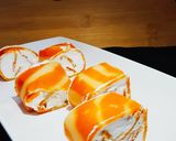 A picture of step 15 of Orange Marble Swiss Roll.