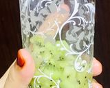 A picture of step 2 of Refreshing orange kiwi mocktail.