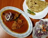 A picture of step 4 of Kerala fish curry 🐠🥥🍅🧄.