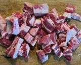 A picture of step 1 of Pork Ribs in Red Sauce with Chile de Árbol.