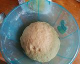 A picture of step 5 of Crunchy soft Mandazi with cinammon and orange rind.