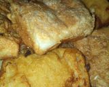 A picture of step 7 of Bread coated with akara paste.