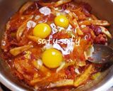 A picture of step 6 of Shakshuka with Leftover French Fries.