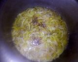 A picture of step 5 of ALU gajar matar meithe,.