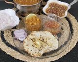 A picture of step 18 of Chur Chur Naan Thali Chole Imli pyaaz chutney laccha pyaaz Chur chur Naan (Punjabi Dinner Thali).