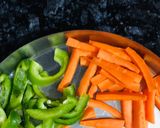 A picture of step 1 of Dragon potatoes with carrots and capsicum.