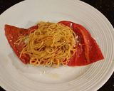 A picture of step 11 of Roasted Red Peppers Stuffed with pasta in a Garlic Broth.