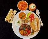 A picture of step 9 of Gujarati lunch thali.