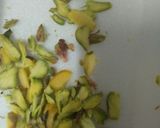 A picture of step 8 of Besan laddoo with sunflower and flax seeds.