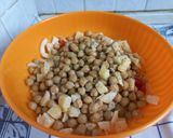 A picture of step 4 of Chickpea Salad with Tomatoes, Olives, Parmesan, and Fennel.