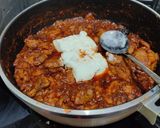 A picture of step 7 of Chicken Pörkölt (Hungarian paprika stew).