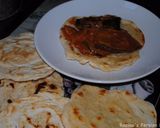 A picture of step 9 of Eggplatns onions with tomato sauce.